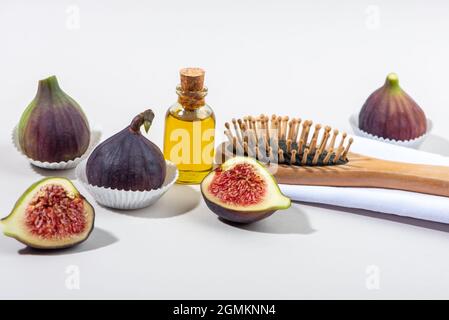 Frische Feigenfrüchte und ätherisches Öl Rezept für die Haarpflege. Stockfoto