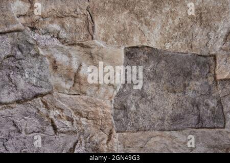 Ordentlich eingelegte Steinwand bilden eine dekorative Stockfoto