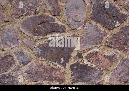 Ordentlich eingelegte Steinwand bilden eine dekorative Stockfoto