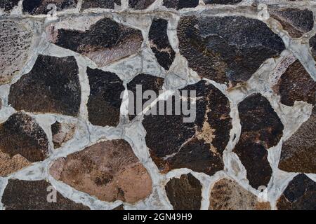 Ordentlich eingelegte Steinwand bilden eine dekorative Stockfoto