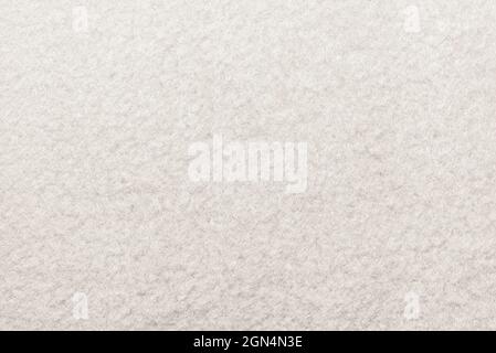 Weiße Qualität. Die Textur des Materials ist hell in der Farbe. Fühlte Sich An. Teppich Stockfoto