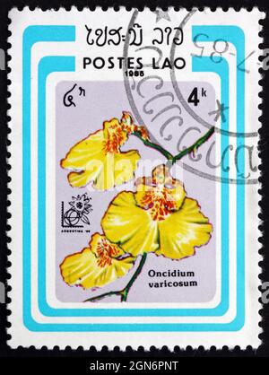 LAOS - UM 1985: Eine in Laos gedruckte Briefmarke zeigt Oncidium Varicosum, Orchid, um 1985 Stockfoto