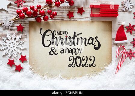 Leuchtend rote Weihnachtsdekoration, Papier, Frohe Weihnachten und Ein glückliches 2022 Stockfoto