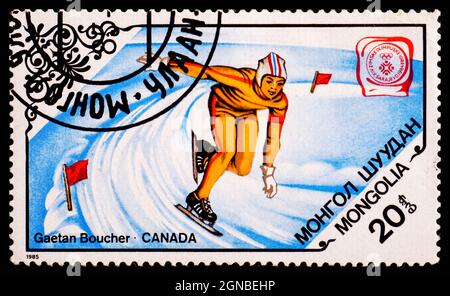 MONGOLEI - UM 1985: Eine Briefmarke aus der Mongolei, die die Olympischen Winterspiele von Gaetan Boucher Canada zeigt Stockfoto