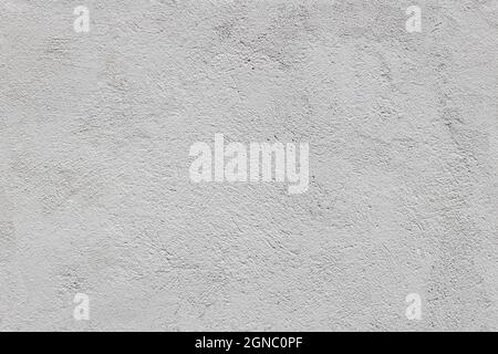 Nahtlose Textur und Vollformathintergrund aus rauem grauem Gips einer Außenwand Stockfoto