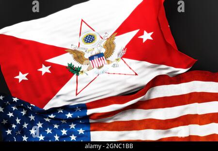 Die Flagge des stellvertretenden Stabschefs der US-Armee zusammen mit einer Flagge der Vereinigten Staaten von Amerika als Symbol für eine Verbindung zwischen ihnen, Stockfoto