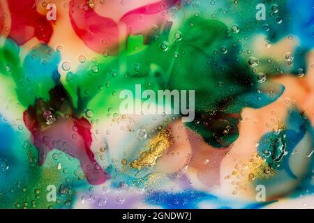 Abstrakt bunten Aquarell Hintergrund. Flüssiges Glas mit Blasen und Goldstaub. Stockfoto