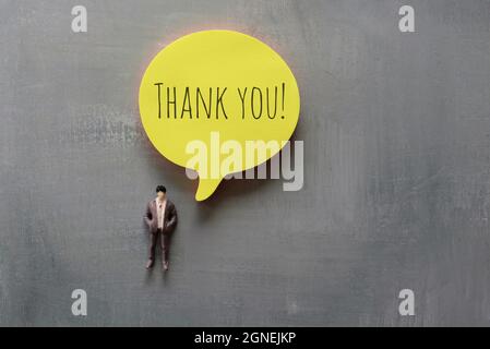 Miniatur Menschen und Blase Rede mit Text DANKE! Stockfoto