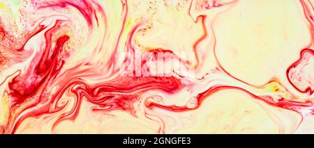 Abstrakter gelb-roter Hintergrund. Abstrakte Farbtinte, psychedelischer Hintergrund. Flüssige Kunst Stockfoto