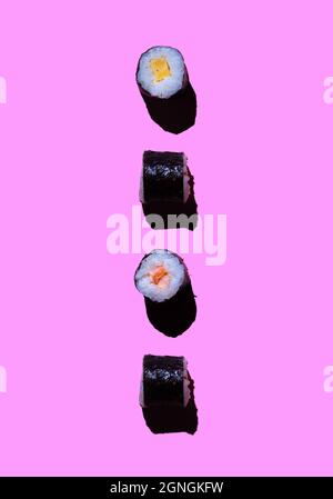 Aufnahme von mehreren Nagiri auf einem rosa Hintergrund. Sushi- und japanisches Speisekonzept Stockfoto