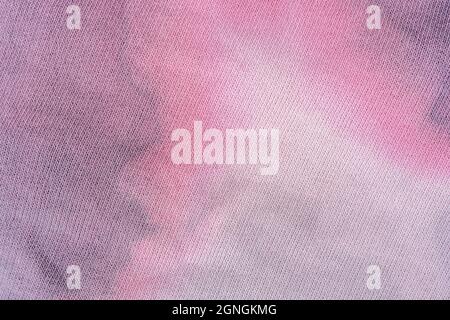 Modische Tie-Dye-Qualität. Baumwollhintergrund Textur für Design. Rosa Textur für jeden Hintergrund. Ökologisch angebaute Baumwolle. Hochwertige Fotos Stockfoto