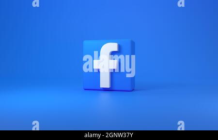Würfel mit Facebook-Logo auf blauem Hintergrund mit Platz für Text. 3D-Rendering. Stockfoto