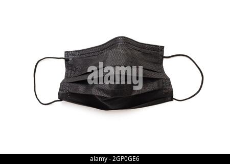 Schützende, schützende schwarze Maske auf Weiß isoliert. Schwarze Gesichtsmaske für starken Dresscode. Stockfoto