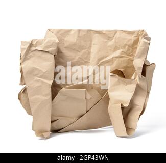 piece of crumpled brown paper isolated on white background, element for designer, torn edges Stock Photo