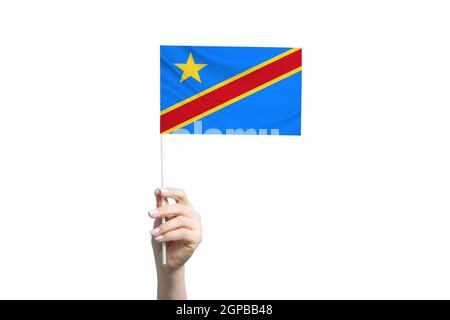 Schöne weibliche Hand hält Demokratische Republik Kongo Flagge, isoliert auf weißem Hintergrund. Stockfoto