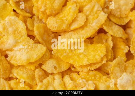Cornflakes Hintergrund und Textur. Ansicht von oben. Traditionelle trockene Frühstücksflocken. Stockfoto