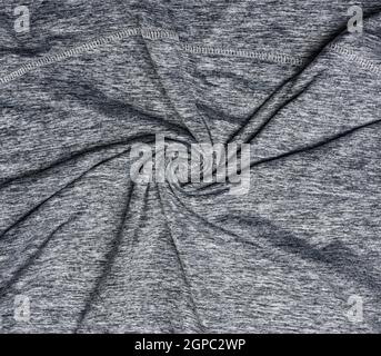 Graues synthetisches, buntes Gewebe zum Nähen von Kleidung, Stoff faltig, Nahaufnahme Stockfoto