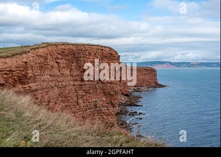 Red Otter Sandstone Cliffs am Danger Point, zu Fuß östlich von Otterton Ledge, Devon Stockfoto