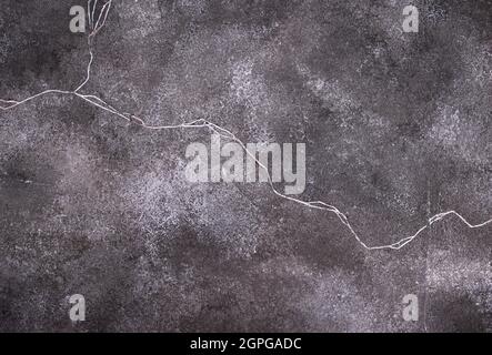 Dunkler abstrakter Beton knistert Hintergrund Stockfoto