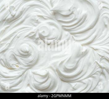 Cremige Pics in Joghurt oder Creme Oberfläche. Draufsicht. Stockfoto