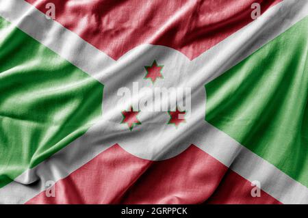 Winkende detaillierte Nationalflagge von Burundi Stockfoto