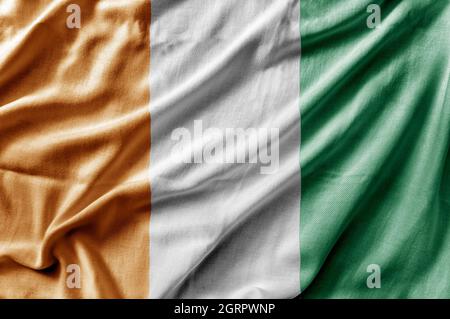 Winkende detailreiche Nationalflagge der Cote d'lvoire Stockfoto