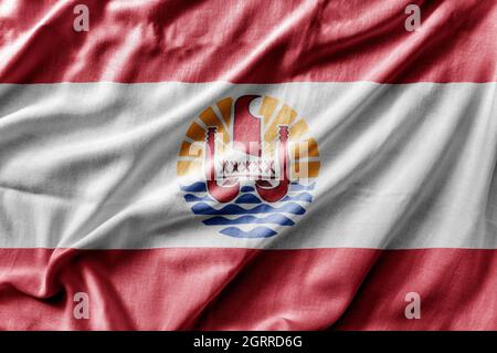 Winkende detailreiche Nationalflagge von Französisch-Polynesien Stockfoto