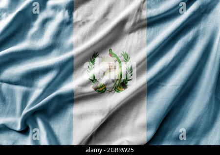 Winkende detaillierte Nationalflagge von Guatemala Stockfoto