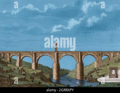 Spanien, Extremadura. Alcántara-Brücke. Römische Brücke. Es wurde auf Befehl des Kaiser Trajan zwischen 104-106 n. Chr. über dem Fluss Thagus erbaut. Gravur. Spätere Färbung. Las Glorias Nacionales. Band I, Ausgabe Madrid-Barcelona, 1852. Stockfoto