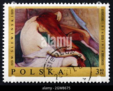 POLEN - UM 1969: Eine in Polen gedruckte Briefmarke zeigt die Haarkämmerin, Gemälde von Wladyslaw Slewinski, um 1969 Stockfoto
