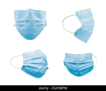 Sammlung von medizinischen Gesichtsmasken in verschiedenen Winkeln isoliert auf Weiß. Stockfoto