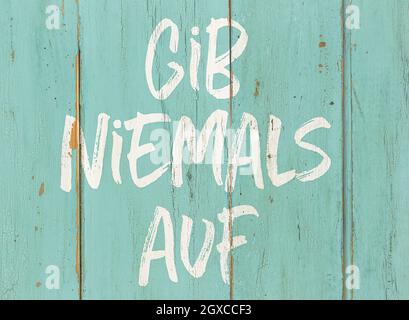 Motivationszitat - Geben Sie nie auf deutsch auf - Gib Niemals auf Stockfoto