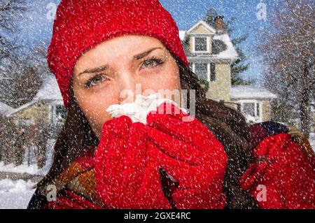 Schwer kranke Frau In fallenden Schnee weht ihre Wunde Nase mit Gewebe außerhalb. Stockfoto