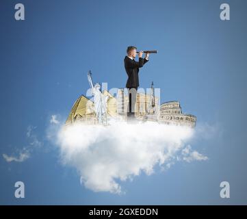 Geschäftsmann träumt von neuen Reisezielen in der Welt Stockfoto