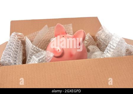 Sparschwein in Luftpolsterfolie verpackt Stockfoto