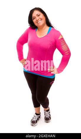 Attraktive applying Hispanic Frau In Trainingskleidung vor einem weißen Hintergrund. Stockfoto