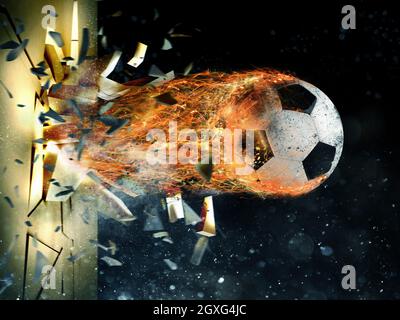 Professionelle Fußball-Feuerball hinterlässt Spuren von Flammen bricht durch eine Wand Stockfoto