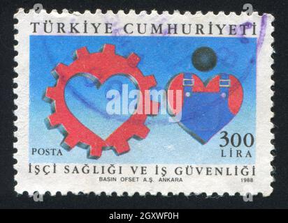 TÜRKEI- UM 1988: Stempel gedruckt von der Türkei, zeigt sichere Arbeitsbedingungen, um 1988 Stockfoto