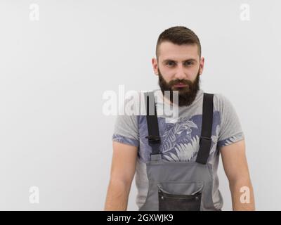 Portrait der junge Bartgeier hipster Heimwerker auf weißem Hintergrund Stockfoto