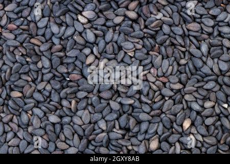 Hintergrund des Essens - viele schwarze Sesamsamen Stockfoto