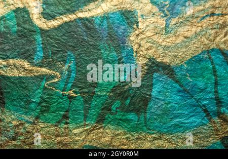 Meergrün, blau und Gold abstrakt wirbelt Papier Textur Hintergrund Stockfoto