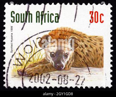 SÜDAFRIKA - UM 1998: Eine in Südafrika gedruckte Briefmarke zeigt Spotted Hyena, Crocuta Crocuta, Animal, um 1998 Stockfoto