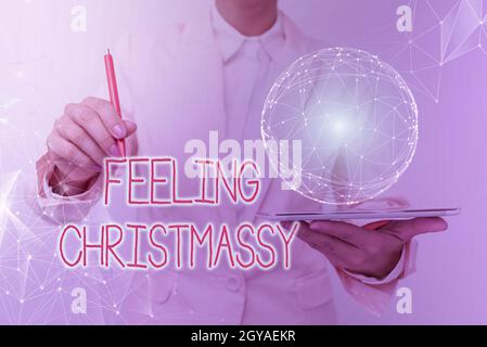 Inspiration, die Zeichen Gefühl Christmassy, Business-Ansatz ähnlich oder mit Gefühle von Weihnachten Festlichkeit Frau in Anzug Holding Tablet mit Stockfoto