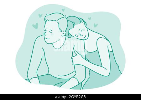 Love, couple in relationship, togetherness concept. Happy young loving girlfriend sitting and hugging her boyfriend during date outdoors. Dating, roma Stock Photo