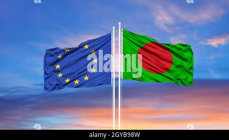 European Union and Bangladesh two flags on flagpoles and blue cloudy sky Stock Photo