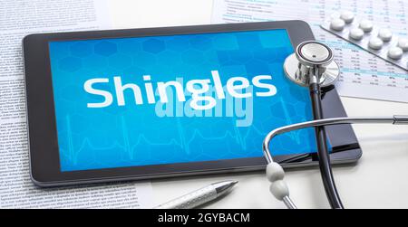 Das Wort zeigt sich auf dem Display eines Tablets Stockfoto
