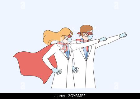 Supermacht der Ärzte während des Coronavirus-Pandemiekonzepts. Mann und Frau Ärzte medizinische Mitarbeiter tragen chirurgische Gesichtsmaske in Superhelden Kostüm-Stand Stockfoto