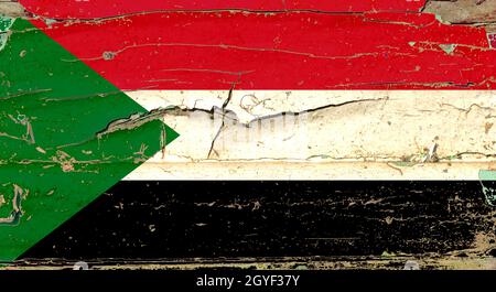 3D Flagge des Sudan auf einem alten Holzwandhintergrund. Stockfoto