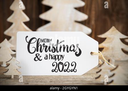 Weihnachtsbaum, Label Mit Englischem Text Frohe Weihnachten Und Happy 2022 Stockfoto