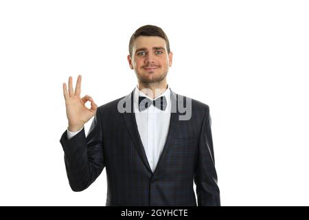 Geschäftsmann zeigt ok Schild, isoliert auf weißem Hintergrund. Stockfoto